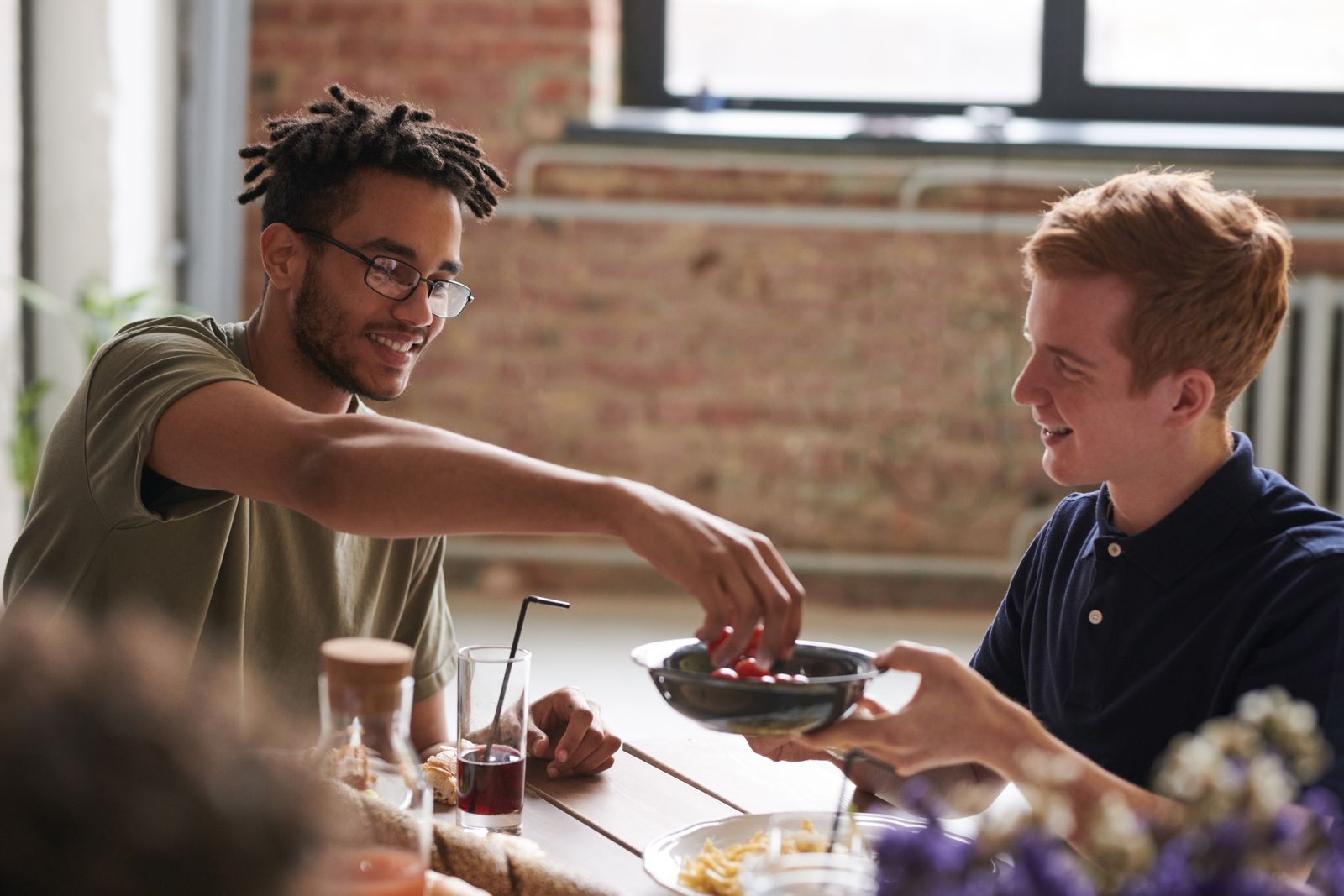 Friends laughing over lunch